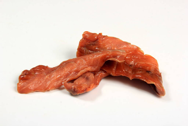 Cold smoked salmon strips on a white background, smoked fish product - Photo, Image