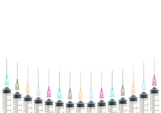 Fundo médico da seringa de cinco cores na vista da linha da curva - Foto, Imagem