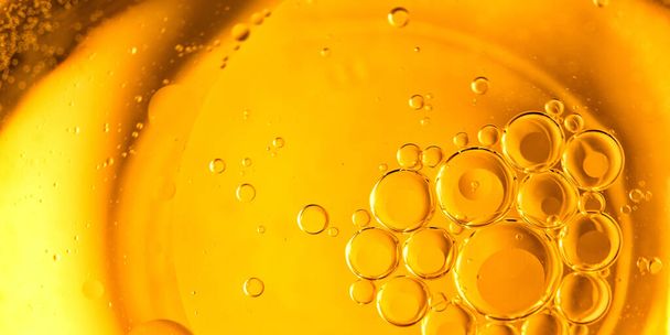 Yellow bubbles background, cooking oil emulsion, frying. - Фото, зображення
