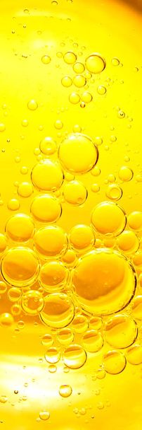 Yellow bubbles background, cooking oil emulsion, frying. - Photo, Image