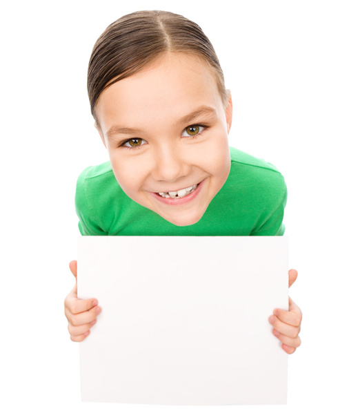 Happy little girl is holding blank board - Φωτογραφία, εικόνα