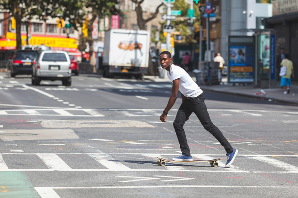 Black Boy Skating with Longboard on the Road - Zdjęcie, obraz