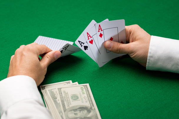 poker player with cards and money at casino - Foto, Imagem