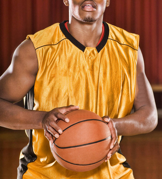 Portrait of Basketball Player shooting ball for 3 points - Photo, Image