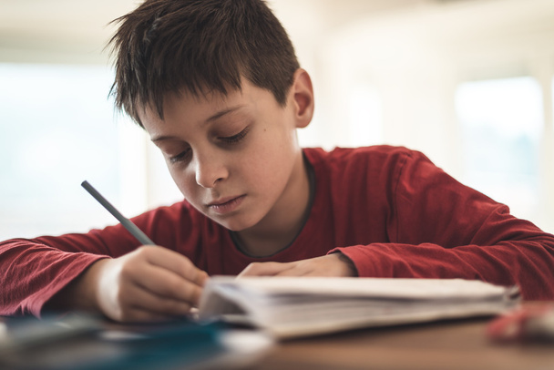 Boy writing - Photo, Image
