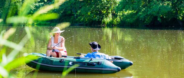 "Couple in boat on pond or lake fishing " - Fotó, kép