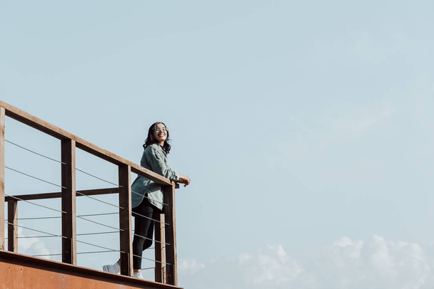 "Woman in a balcony over a massive river and the mountains living the moment liberty and freedom concept, wellness during a sunny day" - Foto, immagini