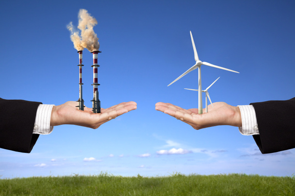 Umweltverschmutzung und Konzept für saubere Energie. Geschäftsmann mit Windmühlen und Raffinerie - Foto, Bild