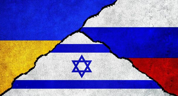 Russia, Ukraine and Israel flag together on wall. Diplomatic relations between Russia, Israel and Ukraine - Photo, Image