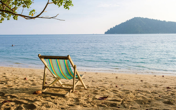 Beach chairs on a tropical beach at Klong Kloi Beach Koh Chang Thailand - Photo, Image
