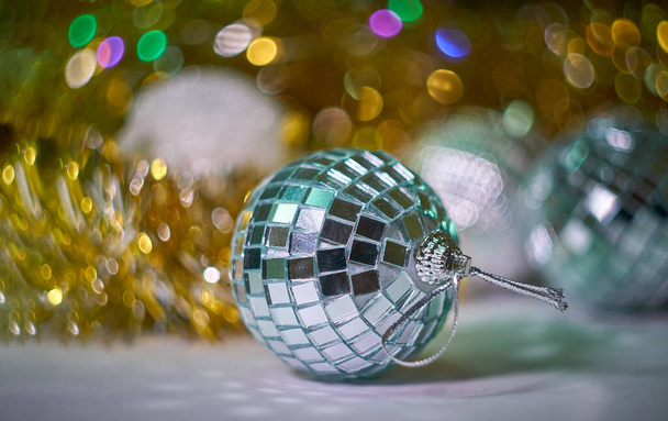 "new year decorations on blurred multicolored led lights background" - Photo, Image