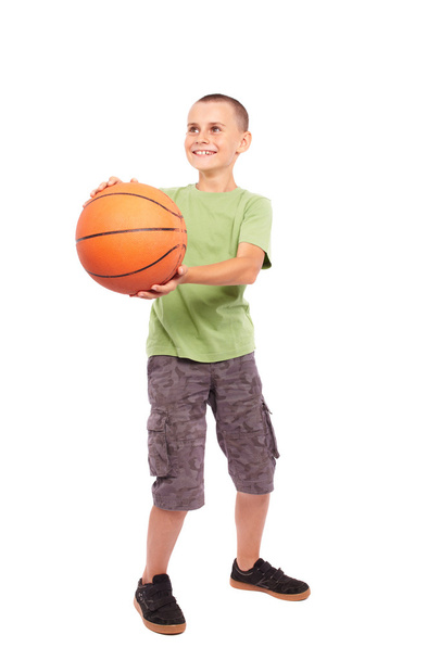 Child with basketball isolated on white background - Fotó, kép