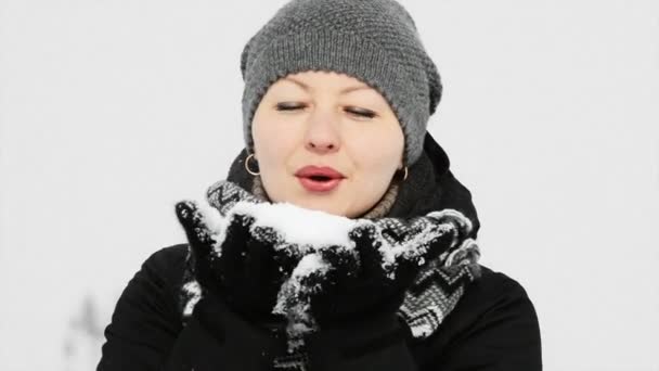 Woman Blowing Snow - Footage, Video