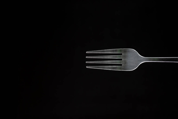 Steel metal Fork isolated black background backlight  backlit kitchen appliances Close-up - Foto, Bild