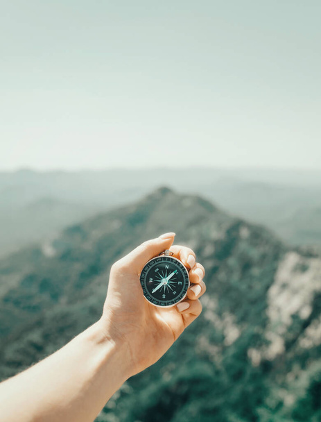 "Woman searching direction with compass in mountains, pov." - Photo, image