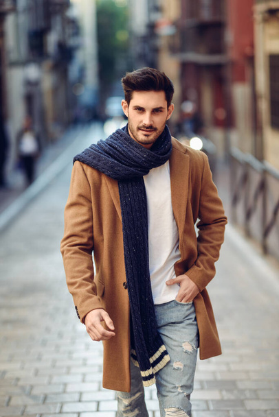 "Young man wearing winter clothes in the street." - Foto, Bild