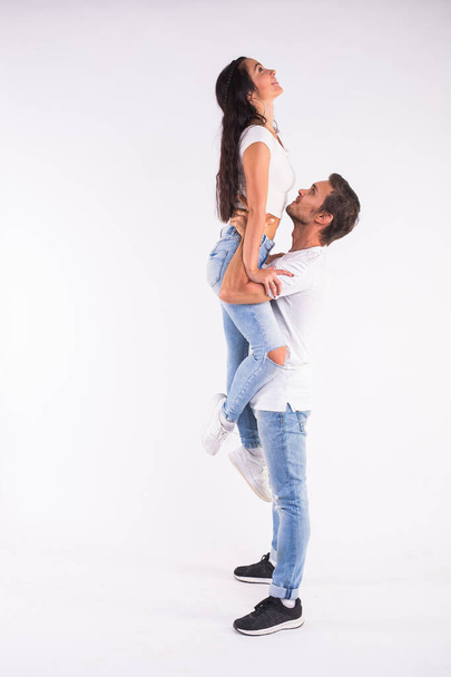 "Young couple dancing social latin dance bachata, merengue, salsa. Two elegance pose on white background" - Photo, Image