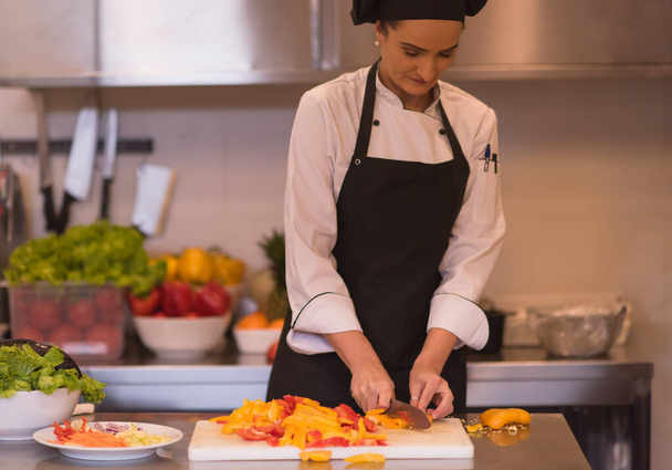 "Chef cutting fresh and delicious vegetables" - Valokuva, kuva