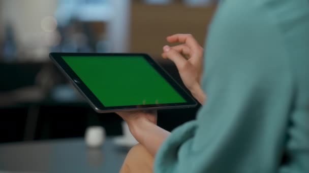 Unrecognized boss zoom out chromakey tablet at lobby closeup. Professional specialist hands touching swiping green screen at coworking. Anonymous woman reducing objects at digital device computer  - Footage, Video
