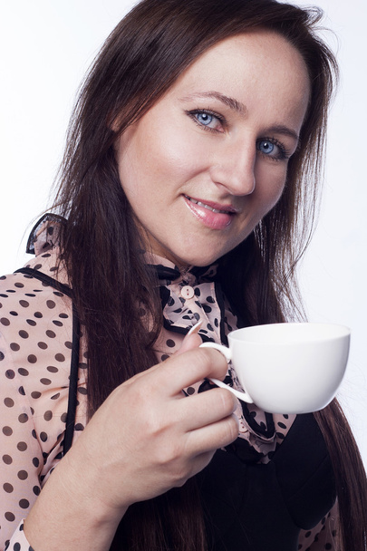 Young woman drinking tea or coffee - Photo, Image