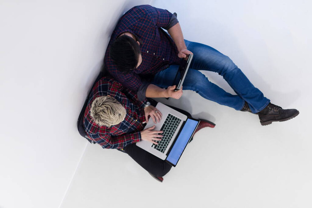 top view of  couple working on laptop computer at startup office - Photo, Image