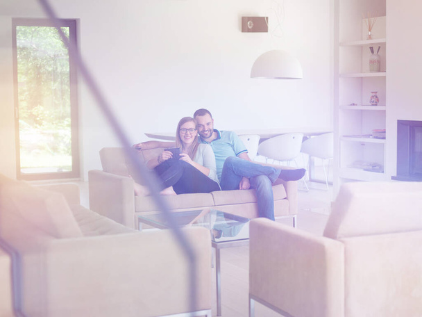 couple relaxing in the living room - 写真・画像