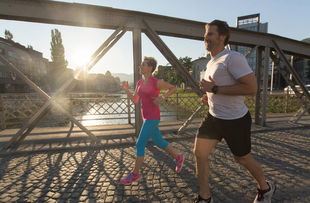 couple jogging in the city - Fotó, kép