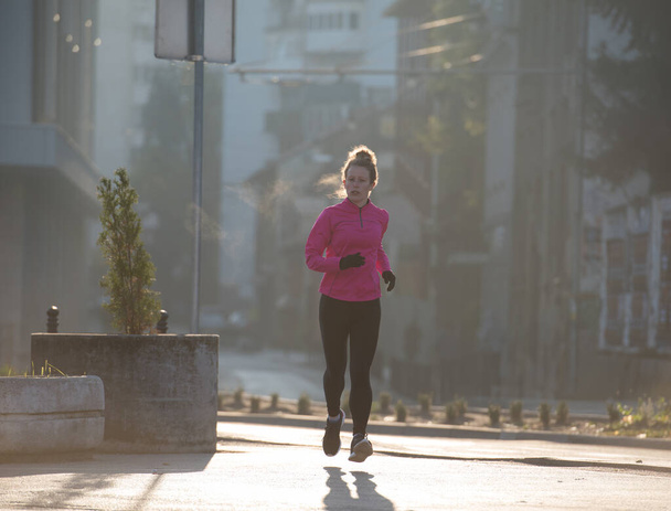 sporty woman jogging on morning - Zdjęcie, obraz