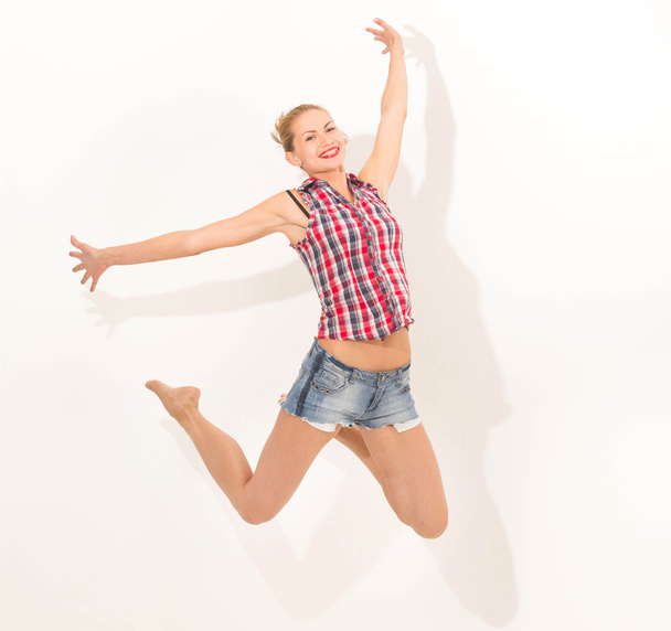 Woman jump studio in the air - Foto, Imagem
