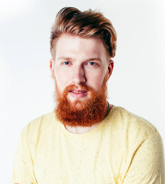 young handsome hipster ginger bearded guy looking brutal isolated on white background, lifestyle people concept - Valokuva, kuva