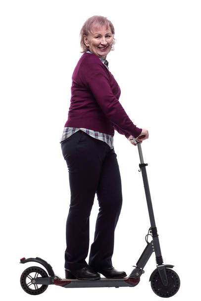 friendly elderly woman on an electric scooter. isolated  - Zdjęcie, obraz