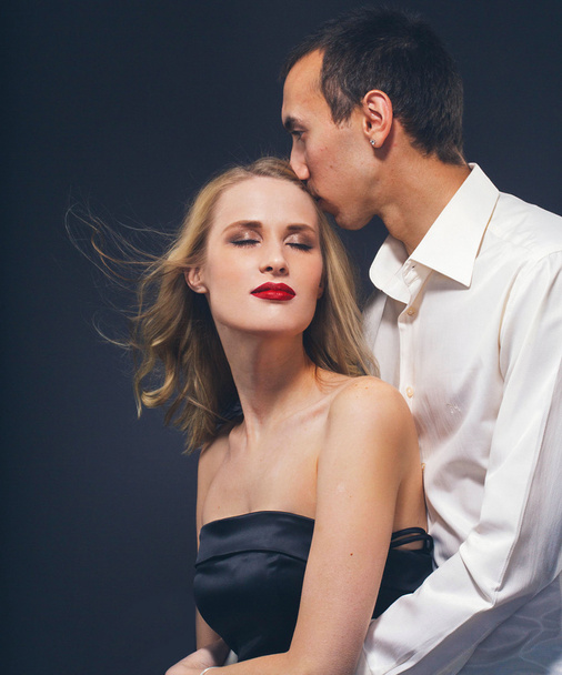 Couple Classic suit black dress woman and man on black background studio with red lipstick and white clothes - Фото, зображення