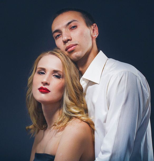 Couple Classic suit black dress woman and man on black background studio with red lipstick and white clothes - Foto, afbeelding