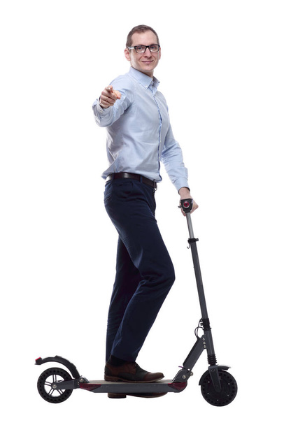 side view. casual man with electric scooter looking at you - Photo, image