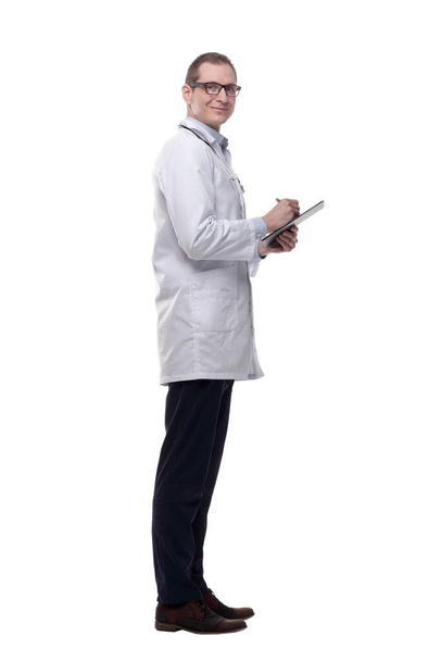 qualified doctor with a clipboard pointing at you . isolated  - Foto, Imagem