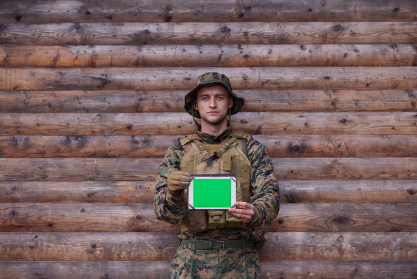 soldier using tablet computer in military camp - Foto, imagen