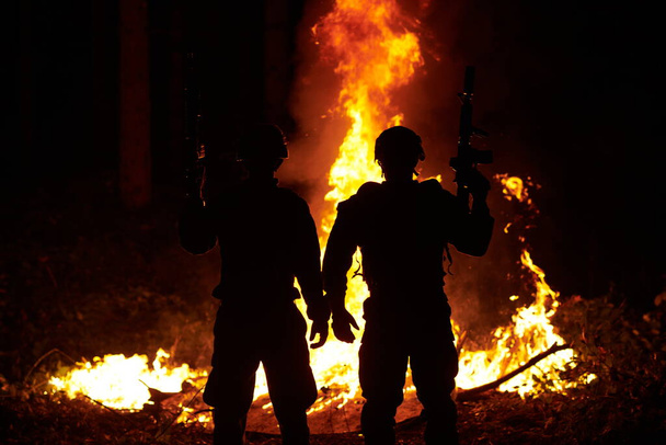 soldiers in action with assault rifles at night  - Photo, Image