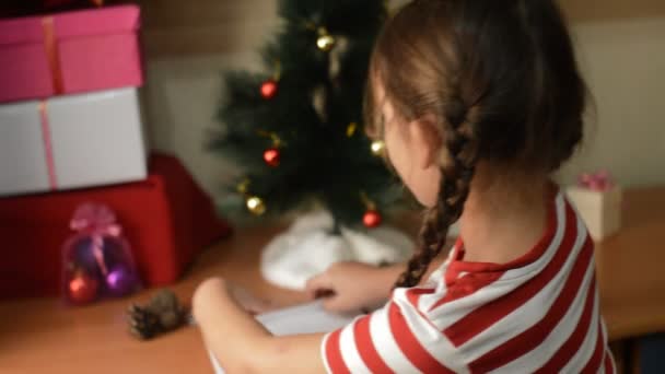 Girl writes letter to Santa - Footage, Video