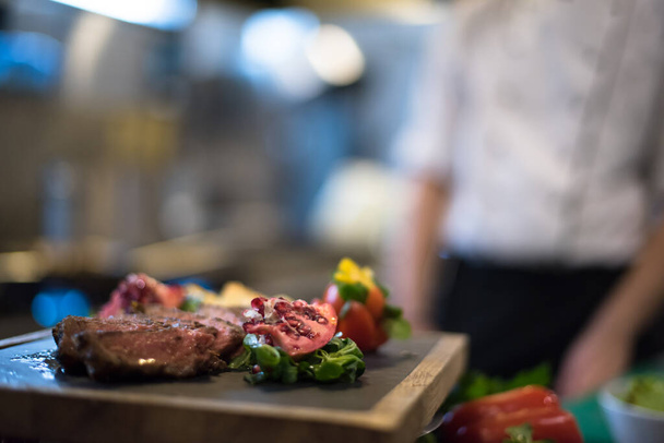 "Juicy slices of grilled steak on wooden board" - Фото, зображення