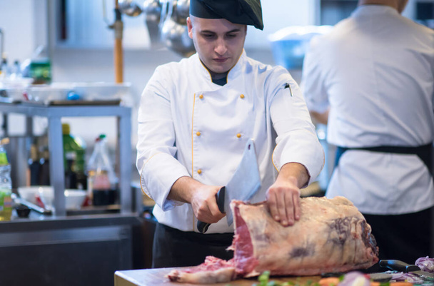 "chef cutting big piece of beef" - Photo, Image