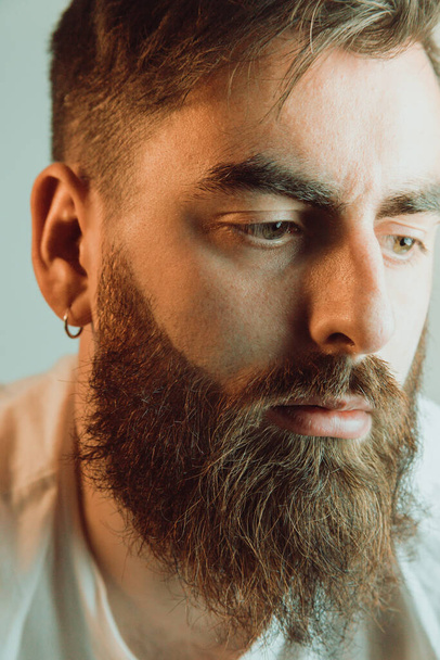 Portrait of a handsome bearded man, hipster style, serious, colorful, beauty and style concepts, lifestyle - Foto, Imagen