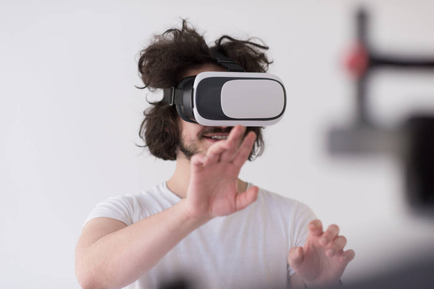 "Man using headset of virtual reality" - Фото, зображення