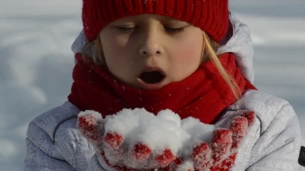 Little girl blowing snow - Felvétel, videó