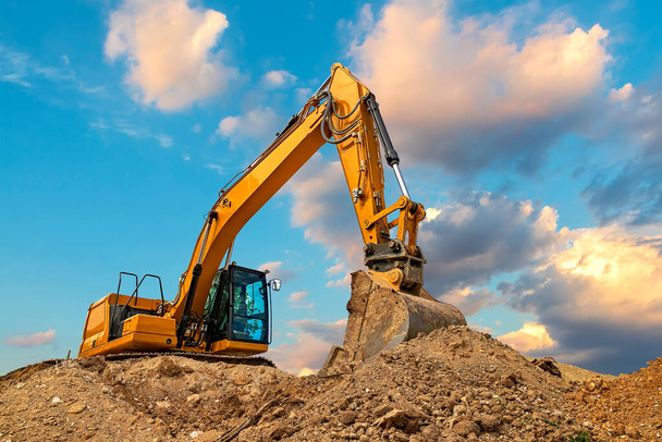 "A stopping yellow excavator at stunning fluffy clouds" - Photo, Image
