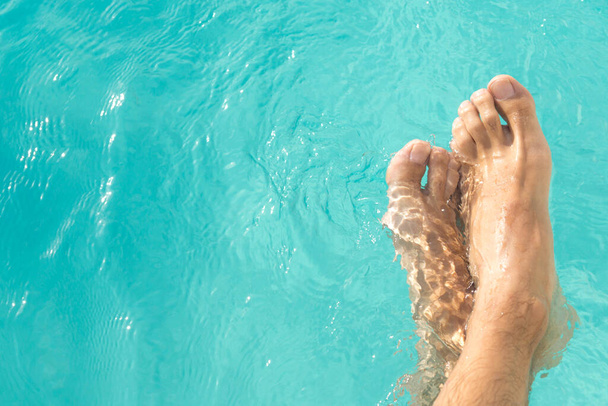 feet in the pool water - Photo, Image