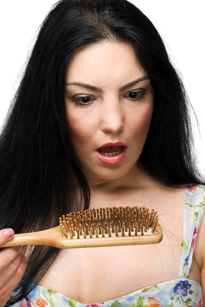 "Mulher chocada perda de cabelo na escova de cabelo" - Foto, Imagem