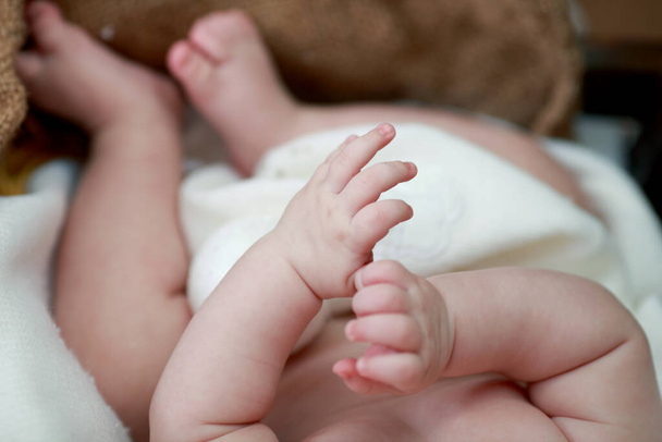 "Baby feet and hands. baby feet. Children's feet and hands .Feet of the tiny Newborn" - Photo, Image