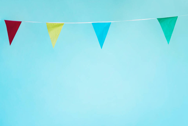 "colorful pennant garland on background, close up - Фото, изображение