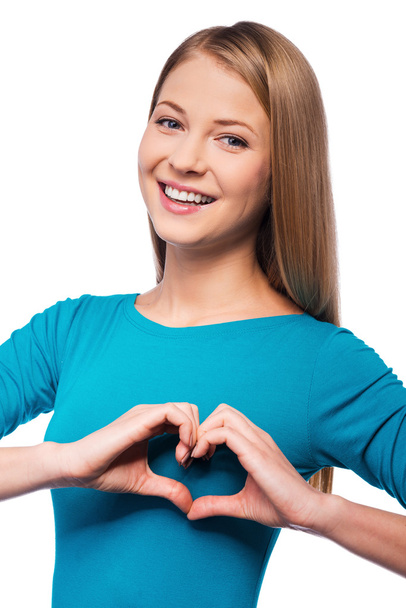 Young woman gesturing finger heart - Photo, Image