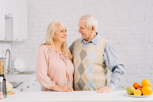 "senior couple together kitchen" - Foto, Imagen